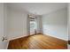 Simple bedroom featuring hardwood floors and a window with outside views at 8 Poulnot Ln, Charleston, SC 29401