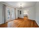 Charming dining room features hardwood floors, neutral walls, and a view of the kitchen at 8 Poulnot Ln, Charleston, SC 29401