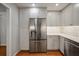 A beautifully updated kitchen with stainless steel appliances, shaker cabinets, and hardwood floors at 8 Poulnot Ln, Charleston, SC 29401