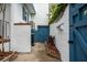 Functional side yard featuring storage shed, brick planter, and climbing vines on the walls at 8 Poulnot Ln, Charleston, SC 29401