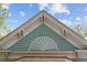 Close-up architectural detail of the roof gable featuring light blue patterned shingles and decorative white molding at 803 S Main St, Summerville, SC 29483