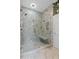 Luxurious bathroom showcasing a glass-enclosed shower with marble tiling and a built-in bench at 803 S Main St, Summerville, SC 29483