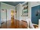 Stylish bedroom with built-in shelving, hardwood floors, and a doorway leading to another room at 803 S Main St, Summerville, SC 29483