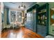 Bedroom featuring custom blue cabinetry with built-in shelving and hardwood floors at 803 S Main St, Summerville, SC 29483
