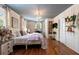 Bedroom featuring natural light, hardwood flooring, chandelier, and closet at 803 S Main St, Summerville, SC 29483
