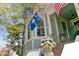 Close-up of charming light blue home and bay window featuring the South Carolina state flag at 803 S Main St, Summerville, SC 29483