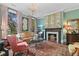 Cozy living room with a fireplace, decorative wall art, comfortable seating, and a patterned rug at 803 S Main St, Summerville, SC 29483
