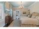 Charming main bedroom featuring a decorative ceiling, classic decor, and wood floors at 803 S Main St, Summerville, SC 29483