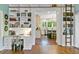 Bright office space with built-in shelves and view to kitchen area at 803 S Main St, Summerville, SC 29483