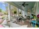 Spacious front porch featuring comfortable seating, a porch swing, and decorative plants, ideal for outdoor living at 803 S Main St, Summerville, SC 29483