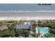 Aerial view showing the pool and beach with people enjoying a beautiful day at 83 Blue Heron Pond Rd, Kiawah Island, SC 29455