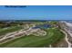 Aerial view of a beautiful green golf course with trees and ponds on a sunny day at 83 Blue Heron Pond Rd, Kiawah Island, SC 29455