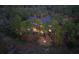 An aerial view shows the house nestled in a wooded, marshy area with privacy at 83 Blue Heron Pond Rd, Kiawah Island, SC 29455