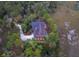 An aerial view showcases the pool and landscape surrounding this beautiful home at 83 Blue Heron Pond Rd, Kiawah Island, SC 29455