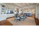 Spacious dining area featuring a dining table with seating and views of the kitchen area and bar at 83 Blue Heron Pond Rd, Kiawah Island, SC 29455