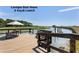 View from the Cassique Boat House dock with a seating area and a peaceful waterfront setting at 83 Blue Heron Pond Rd, Kiawah Island, SC 29455