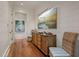 Hallway featuring wood floors and white shiplap walls at 83 Blue Heron Pond Rd, Kiawah Island, SC 29455