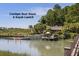 Exterior view of kayak launch at Cassique Boat House surrounded by natural marsh and waterway views at 83 Blue Heron Pond Rd, Kiawah Island, SC 29455