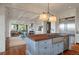 Open kitchen featuring a butcher block island, stainless steel appliances, and views of the living and dining areas at 83 Blue Heron Pond Rd, Kiawah Island, SC 29455