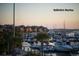 Picturesque marina view with boats docked on the water, complemented by palm trees and waterfront homes at 83 Blue Heron Pond Rd, Kiawah Island, SC 29455