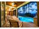 Beautiful outdoor pool and covered seating area, ideal for entertaining and enjoying the scenery at 83 Blue Heron Pond Rd, Kiawah Island, SC 29455