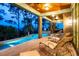 Beautiful outdoor pool and covered seating area, ideal for entertaining and enjoying the scenery at 83 Blue Heron Pond Rd, Kiawah Island, SC 29455