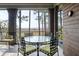 An outdoor seating area with a glass table and views of the water at 83 Blue Heron Pond Rd, Kiawah Island, SC 29455