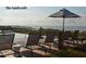 Patio with an ocean view, chairs, umbrellas and a swimming pool at 83 Blue Heron Pond Rd, Kiawah Island, SC 29455