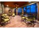 Relaxing screened-in porch with comfortable seating and serene outdoor views at 83 Blue Heron Pond Rd, Kiawah Island, SC 29455