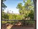 Serene outdoor balcony featuring a beautiful view of wooded landscapes and distant marshlands at 83 Blue Heron Pond Rd, Kiawah Island, SC 29455