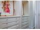 Custom walk-in closet featuring built-in shelves, drawers with crystal pulls and stylish decor at 83 Blue Heron Pond Rd, Kiawah Island, SC 29455