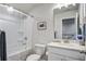 Bright bathroom featuring a shower-tub combo, white vanity, and nautical decor at 832 Descartes St, Summerville, SC 29486