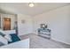 Bedroom view with TV and daybed with coastal pillows at 832 Descartes St, Summerville, SC 29486