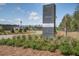 Entrance to Hammock Walk, a 55+ community surrounded by lush landscaping and trees at 832 Descartes St, Summerville, SC 29486