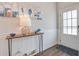 Inviting entryway with stylish console table, decorative accents, and wainscoting at 832 Descartes St, Summerville, SC 29486