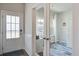 Inviting entryway with glass paneled door and adjacent office featuring french doors and natural light at 832 Descartes St, Summerville, SC 29486