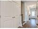 Hallway features hard wood floors, a closet, and staircase to the second floor at 832 Descartes St, Summerville, SC 29486