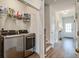 Hallway with washer and dryer, hard wood floors, a closet, and staircase to the second floor at 832 Descartes St, Summerville, SC 29486