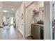 Hallway with washer and dryer, hard wood floors, a closet, and a view of the home's exterior at 832 Descartes St, Summerville, SC 29486