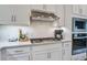 Well-equipped kitchen showcasing sleek cabinetry, stainless appliances, and stylish backsplash at 832 Descartes St, Summerville, SC 29486