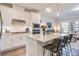 Bright kitchen featuring a large island, stainless appliances, and seamless flow into the living area at 832 Descartes St, Summerville, SC 29486