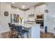 Modern kitchen with stainless steel appliances, quartz countertops, and a stylish breakfast bar at 832 Descartes St, Summerville, SC 29486