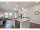 Bright, open layout with a modern kitchen island flowing into a comfortable living area at 832 Descartes St, Summerville, SC 29486