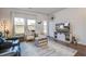 Stylish living room with hardwood floors, backyard views, and a entertainment center at 832 Descartes St, Summerville, SC 29486
