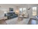 Cozy living room with hardwood floors, natural light, and comfortable seating arrangement at 832 Descartes St, Summerville, SC 29486