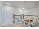 Upstairs loft area with small table and chairs adjacent to staircase at 832 Descartes St, Summerville, SC 29486
