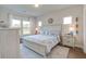 Serene main bedroom with natural light, white furniture, and coastal-inspired decor at 832 Descartes St, Summerville, SC 29486