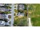 Aerial view of golf course homes, showcasing premium landscaping and convenient street access at 9 Intracoastal Ct, Isle of Palms, SC 29451