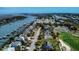 Beautiful aerial view of waterfront homes with private docks next to golf course and waterway at 9 Intracoastal Ct, Isle of Palms, SC 29451