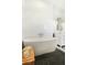 A standalone soaking tub sits on a black, patterned tile floor in this beautifully tiled bathroom at 9 Intracoastal Ct, Isle of Palms, SC 29451